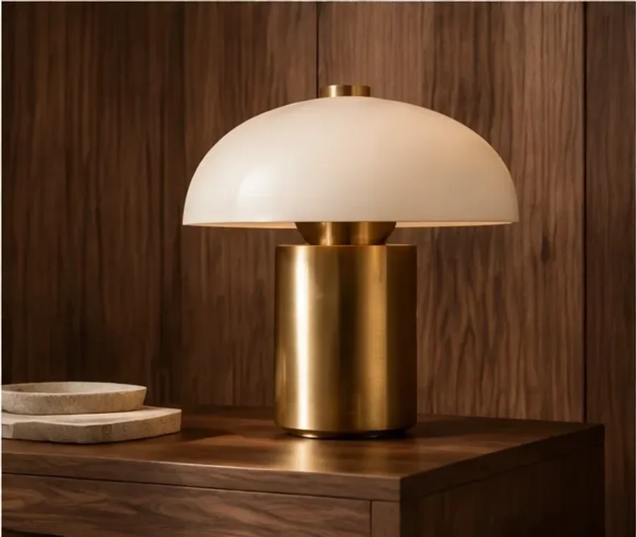 Decorative brass table lamp against warm walnut
