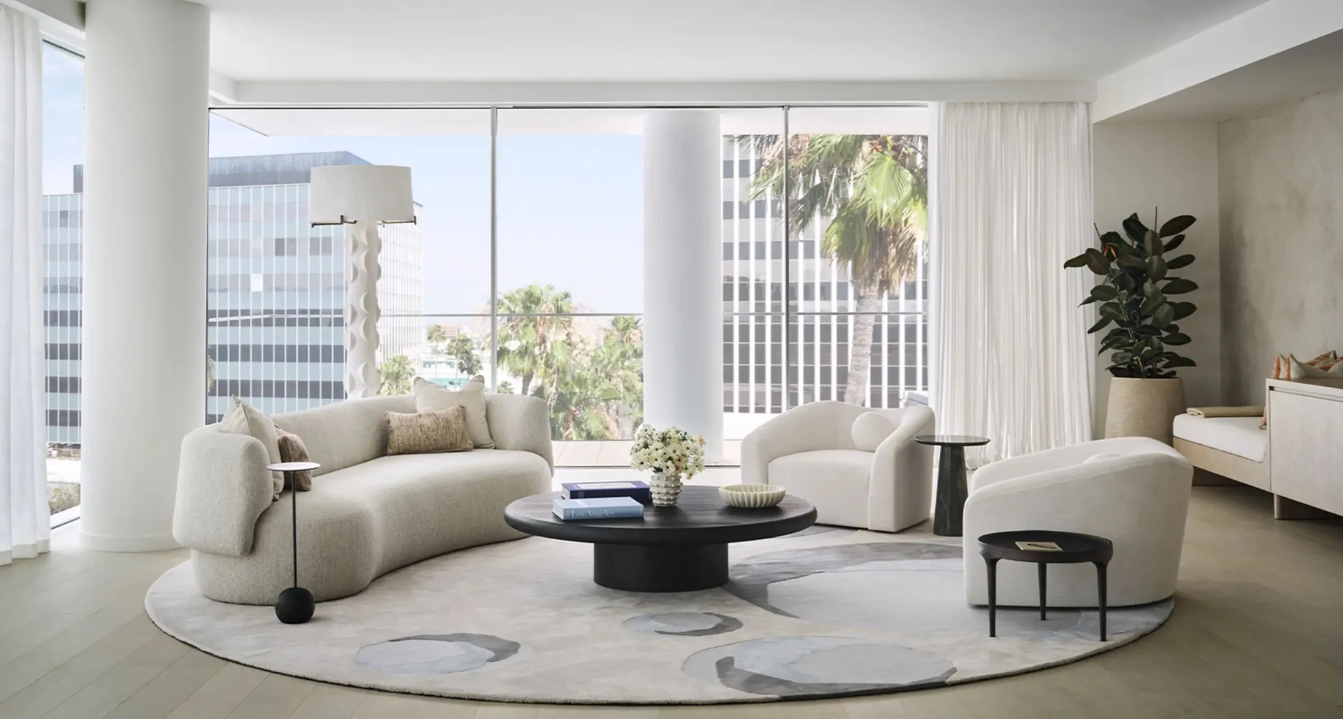 Bright contemporary hospitality interior with curated furniture and artwork